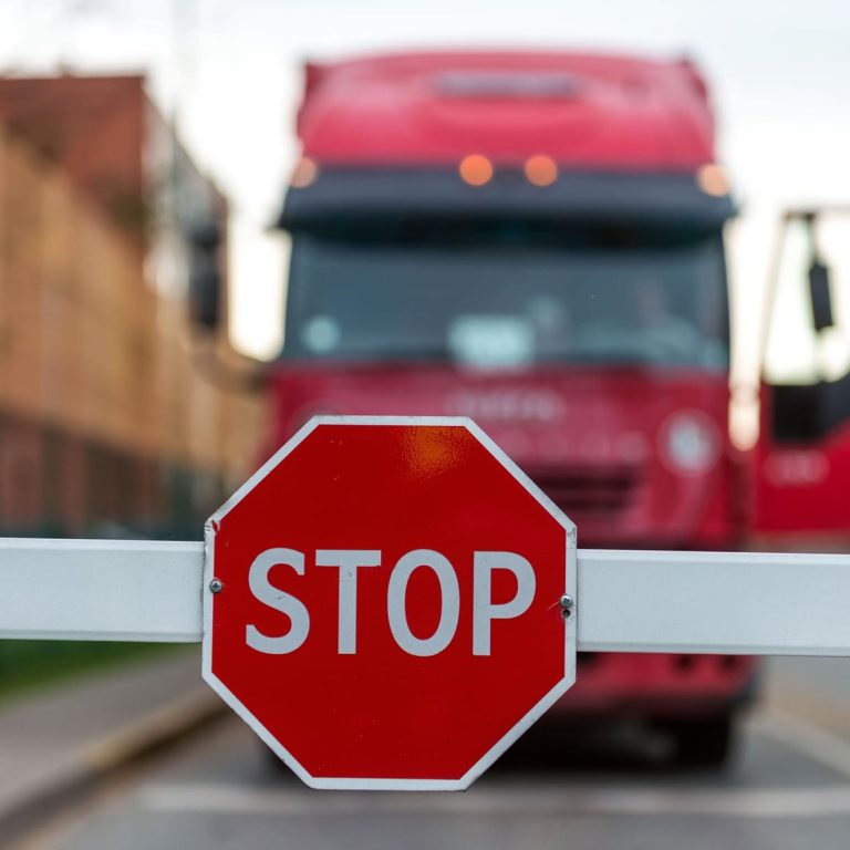 truck-standing-at-the-barrier-with-a-stop-sign-2025-04-02-16-23-36-utc (1) (1)